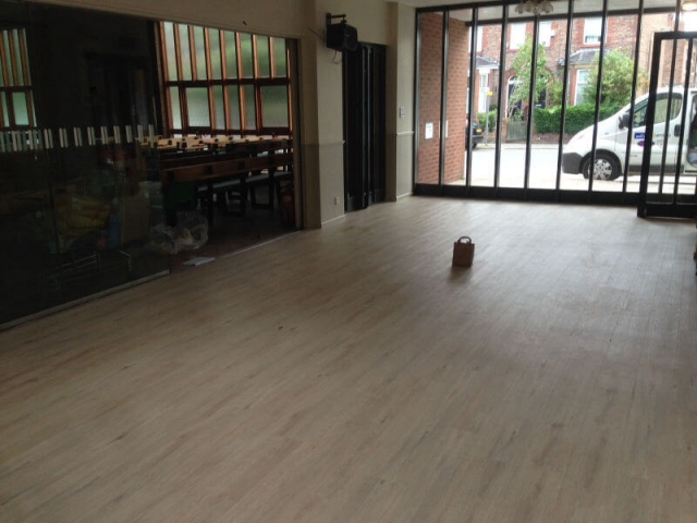 Commercial luxury vinyl tile being fitted at Trinity Church Cheadle