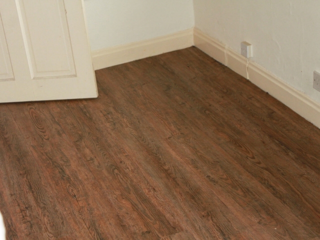 Luxury vinyl tiles installed in a bedroom