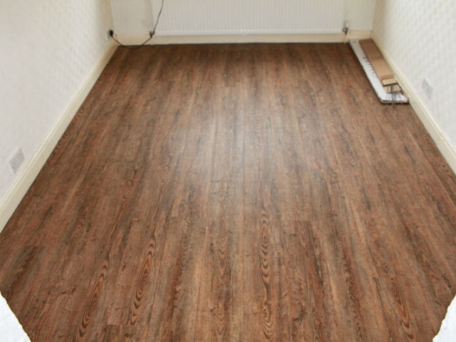 Luxury vinyl tiles installed in a bedroom