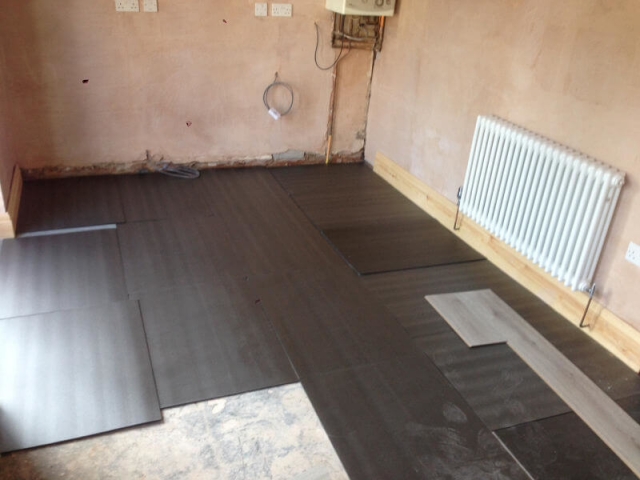 Korona Swiss advanced 8mm laminate being fitted to a kitchen in Poynton