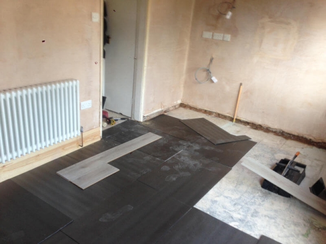 Korona Swiss advanced 8mm laminate being fitted to a kitchen in Poynton