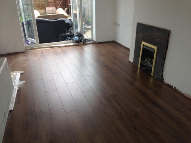 Advanced 8mm laminate millennium oak brown installed in a living room