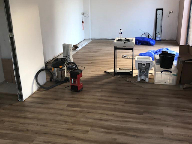 Polyflor Camaro Siena oak fitted to a kitchen and living room