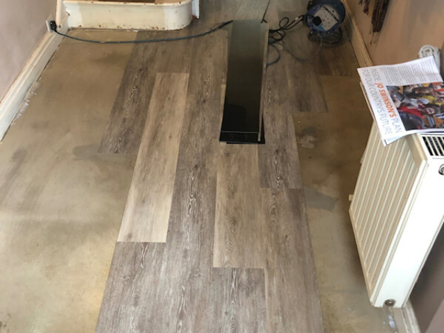 Polyflor Camaro LVT in Boathouse oak being fitted