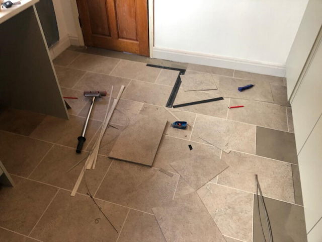 New luxury vinyl tile flooring being fiited