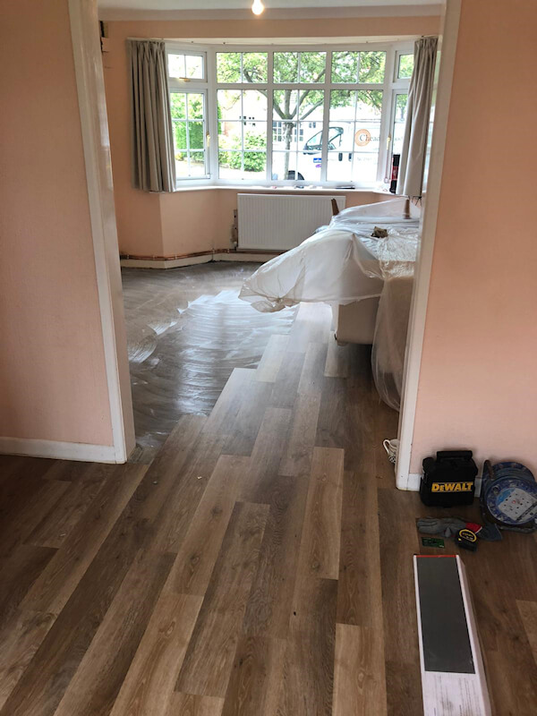 Karndean Pale Limed Oak fitted in lounge dinner and parquet planks fitted in hall
